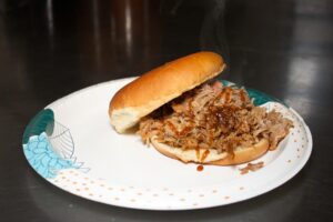 A photo of pulled pork BBQ Sandwich.