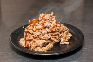 A photo of pulled pork BBQ at Preacher's Smokehouse.