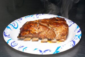 A photo of Pork ribs on a plate at Preacher's Smokehouse.